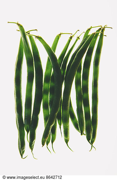 Organic green string beans on white background