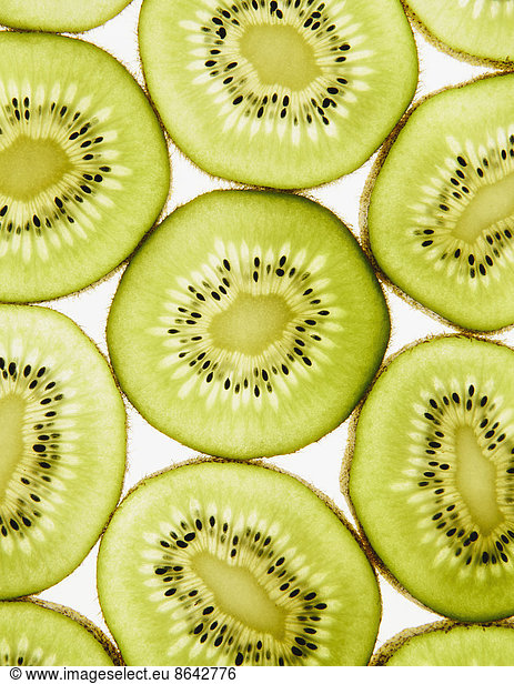 Organic kiwi slices  white background