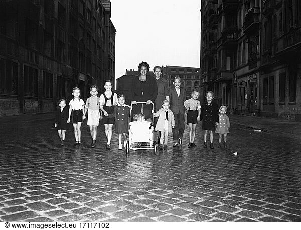 Orphans / Childcare. Orphans with a childminder on the street. Photo  undated (1950s).