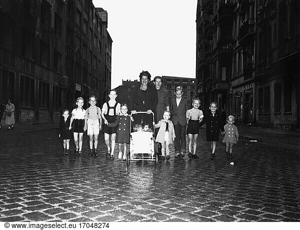 Orphans / Childcare. Orphans with childminder on the street. Photo  undated (1950s).