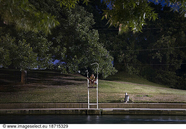 Out and about in Austin  TX: A lifegaurd at Barton Springs watches over the pool
