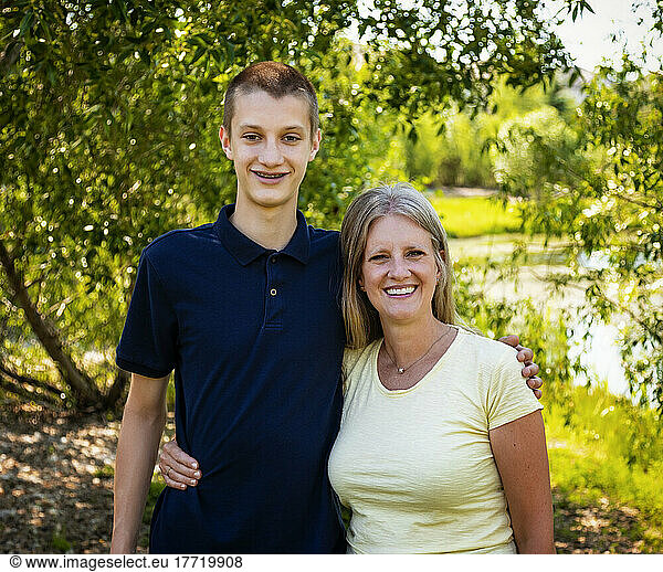 Outdoor portrait of a mother with her teenage son; Edmonton  Alberta  Canada