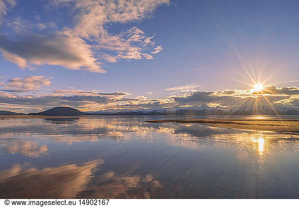 Outgoing tide at sunset with the Chilkat Mountains in the distance  Eagle Beach State Recreation Area  near Juneau; Alaska  United States of America