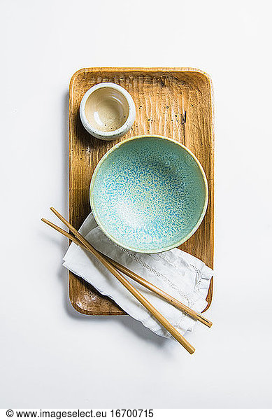 Overhead Top Down Asian inspired kitchenware blue bowl and chopsticks