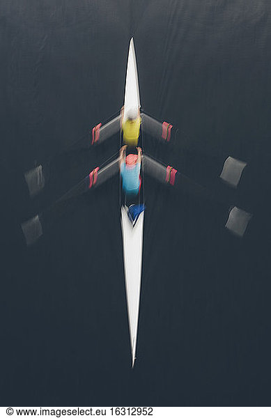 Overhead view of a double scull pair rowing together  two people.