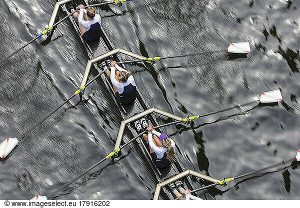 Overhead view of female crew racers rowing in an octuple racing shell  an eights team.