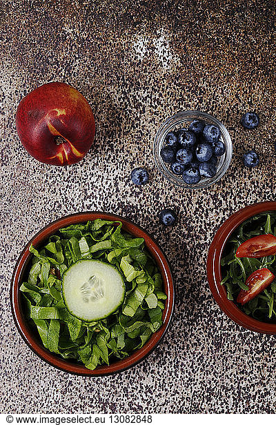 Overhead view of fresh fruits and vegetables on table
