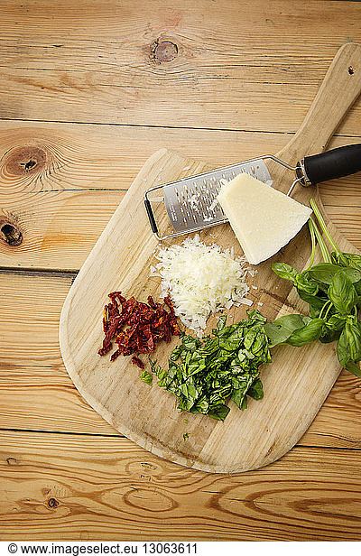 Overhead view of ingredient on cutting board at table
