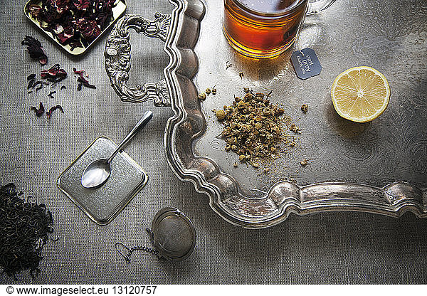 Overhead view of ingredients with tea cup on table