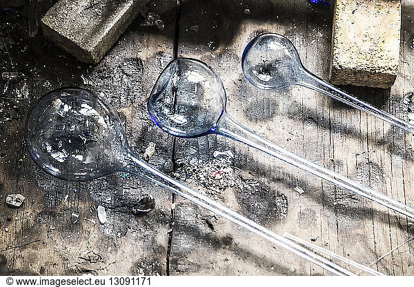 Overhead view of manufactured glasses on work bench at factory