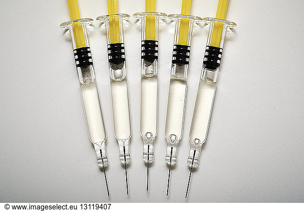 Overhead view of syringes in row on table at hospital