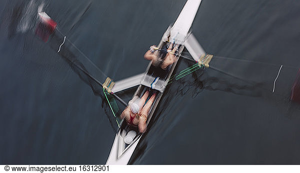 Overhead view of two people rowing in a scull  a pair in a boat