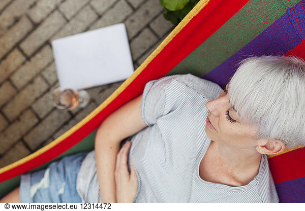 Overhead view of woman relaxing on hammock