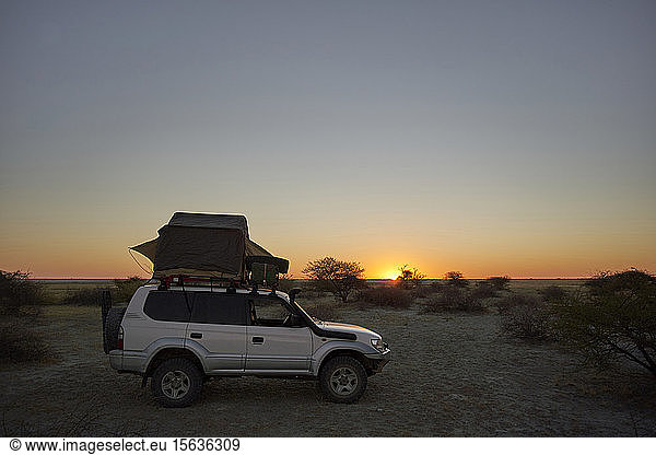 Overlanding against clear sky during sunset. Makgadikgadi Pans  Botswana.