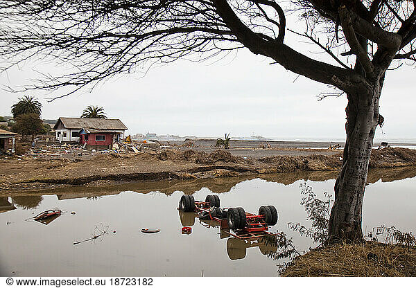 Overturned vehicle submerged up to its wheels in flood waters after the devastating earthquake and subsequent tsunami that struck in early 2010.