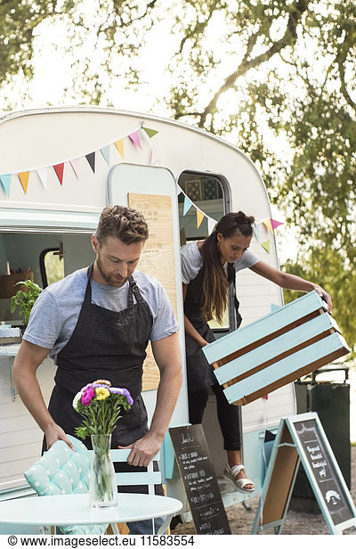 Owners working outside food truck on street