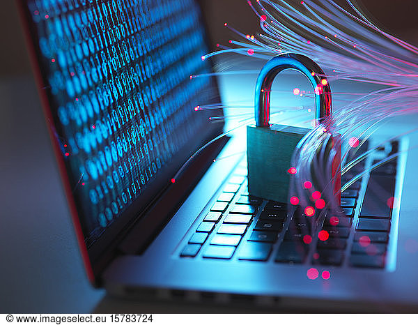 Padlock protecting laptop from computer virus represented by optical fibers