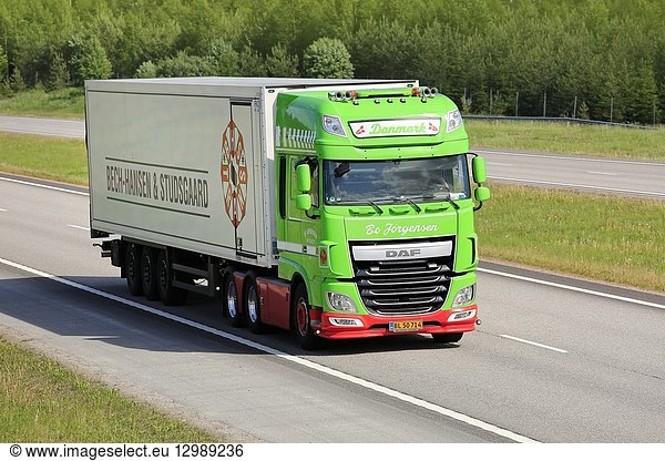 Paimio  Finland - June 1  2018: Lime green DAF XF truck Danmark of Bo Jorgensen in front of FRC semi trailer on motorway on a sunny day of summer.