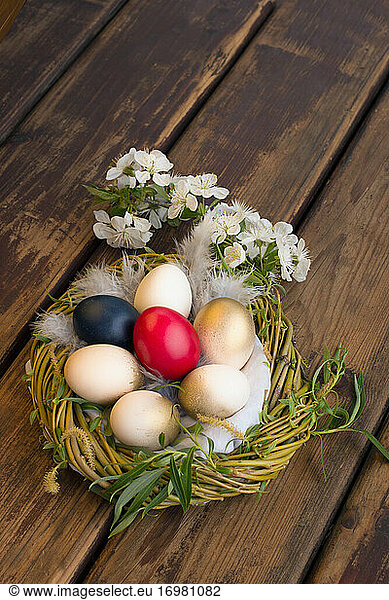 Painted eggs in the nest to celebrate Easter