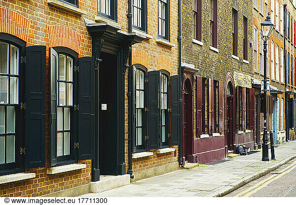 Painted Open Shutters On Windows Of Brick Buildings  Spitalfields; London  England
