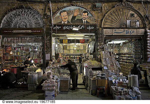 Painting of Basil and Hafez al-Assad in the Souk in Damascus  Syria.
