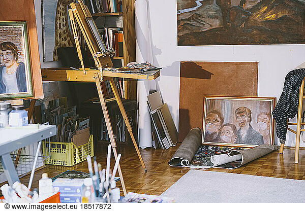Paintings and art equipment in studio