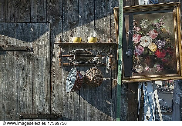 Paintings and bric-a-brac on old wooden wall  Auer Dult  Munich  Bavaria  Germany  Europe