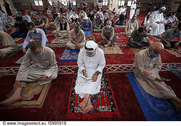 Palestinians Muslims sit at a social distance from each other as a precaution  during Friday prayers in Southern Gaza  May 22  2020. Authorities have decided to partially reopen mosques for prayers on the last Friday in the blessed month of Ramadan nearly after two months after closure due to the Coronavirus (COVID-19).