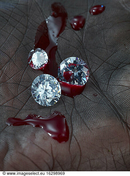 Palm with three diamonds and blood  close-up