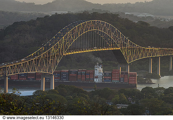 Panama  Panama City  Cargo ship passing the Bridge of the Americas on the Panama canal