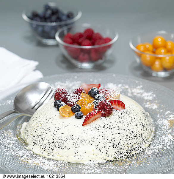 Panna Cotta with fruits on plate  close-up