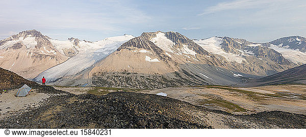 Panorama of man camping above Athelney Pass  Canada.