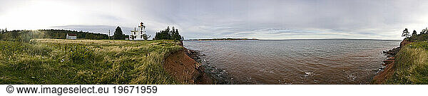 Panorama of the lighthouse and red soil at Amherst  Prince Edward Island  Canada.