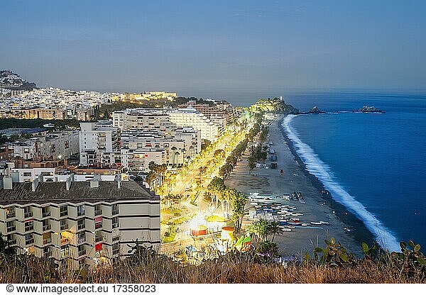 Panorama of touristic illuminated coast in Almunecar at night  Andalusia  Spain  Europe