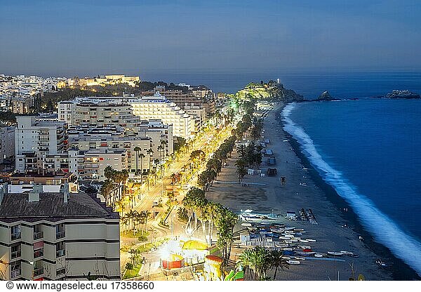 Panorama of touristic illuminated coast in Almunecar at night  Andalusia  Spain  Europe