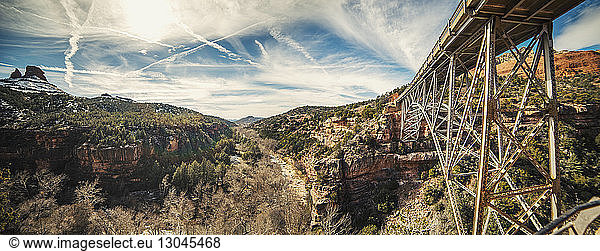 Panoramic view of bridge amidst rocky mountains