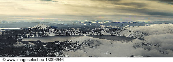 Panoramic view of Crater Lake against cloudy sky during winter