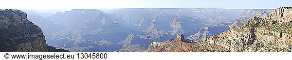 Panoramic view of Grand Canyon on sunny day