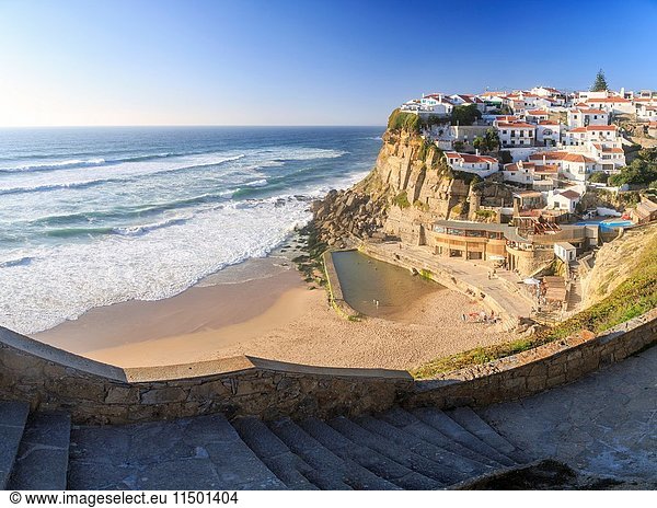 Panoramic view of ocean waves crashing on the high cliffs of Azenhas do Mar Sintra Portugal Europe.