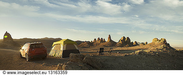 Panoramic view of tent and off road vehicle in front of Trona Pinnacles  Trona  California  USA