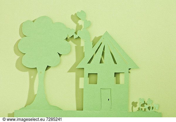 Paper cut out of house and tree