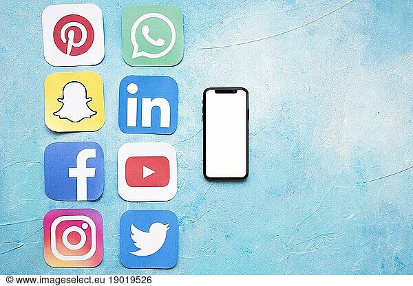 Paper cut outs social media icons arranged near smartphone. Resolution and high quality beautiful photo