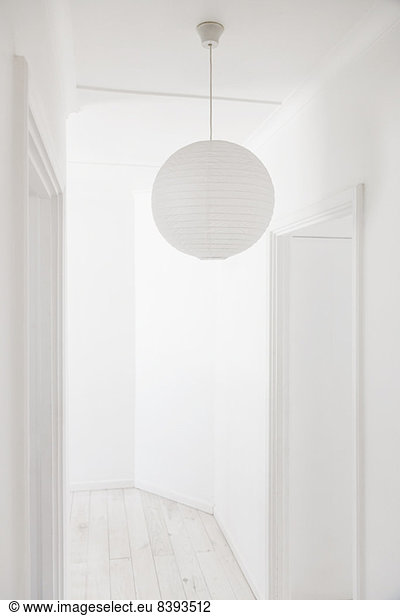 Paper lantern in white corridor