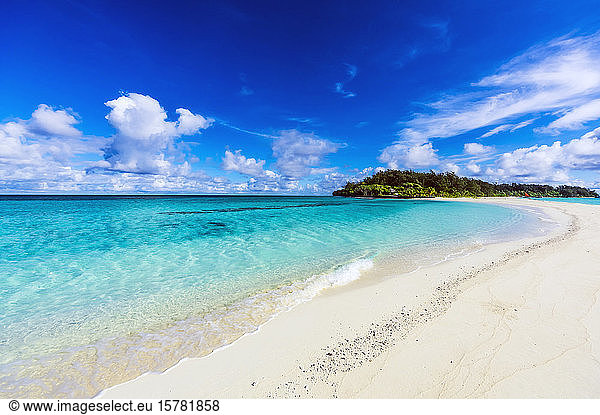 Papua New Guinea  Milne Bay Province  Blue sky over sandy coastal beach of Conflict Islands in summer