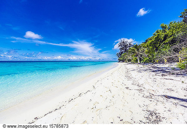 Papua New Guinea  Milne Bay Province  Blue sky over sandy coastal beach of Conflict Islands in summer