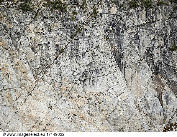 Paralell cracks run through a rocky cliff in the Wallowa Mountains