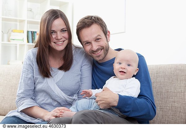 Parents with baby boy (6-11 Months)  portrait  smiling