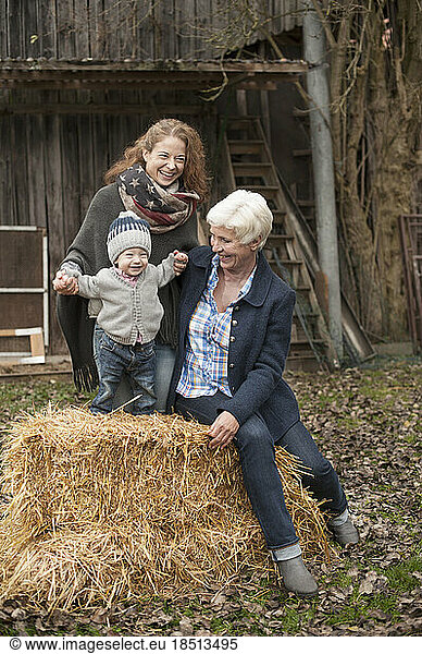 Parents with their little son in the farm  Bavaria  Germany