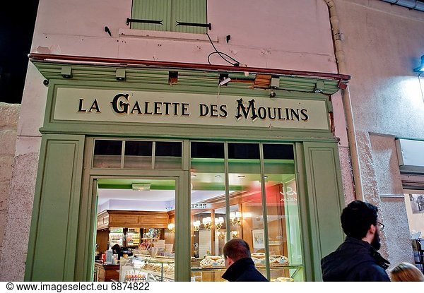 Paris  France  Street Scene  Old Buildings  at Night  with French Bakery Shop  Boulangerie  ´La Galette des Moilins´  in Montmartre District