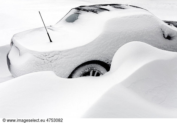 Parked car trapped in a big snowbank  North Rhine-Westphalia  Germany  Europe